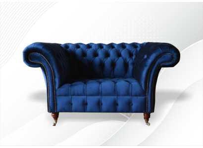 Fotel Chesterfield z tkaniny w kolorze niebieskim. Kreatywne, nowoczesne meble luksusowe do salonu.