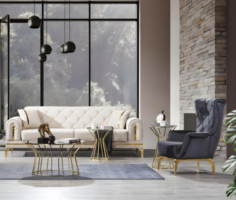 Wyjątkowa sofa Chesterfield i fotel w kolorze białym dla trzech osób i szary fotel.