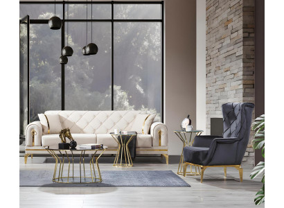Wyjątkowa sofa Chesterfield i fotel w kolorze białym dla trzech osób i szary fotel.