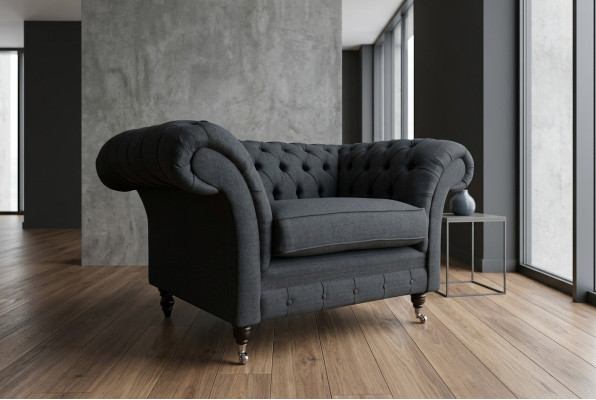 Sofa tapicerowane Chesterfield w kolorze czarnym, jednoosobowe siedzisko.