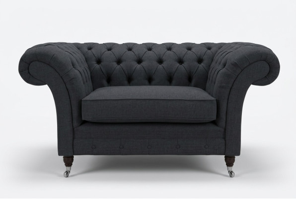 Sofa tapicerowane Chesterfield w kolorze czarnym, jednoosobowe siedzisko.