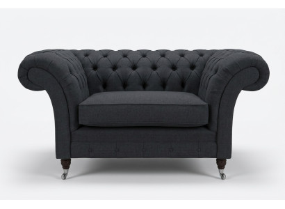 Sofa tapicerowane Chesterfield w kolorze czarnym, jednoosobowe siedzisko.