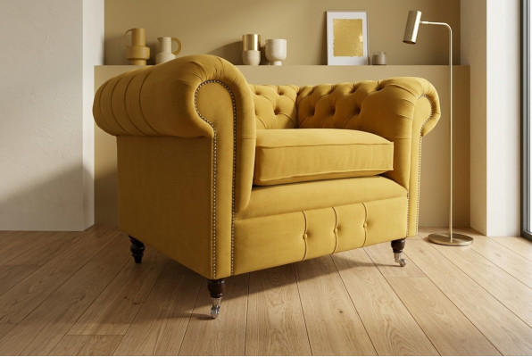 Skrzydłowy fotel klubowy luksusowej strefy relaksu. Sofa Chesterfield.