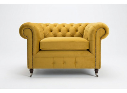 Skrzydłowy fotel klubowy luksusowej strefy relaksu. Sofa Chesterfield.