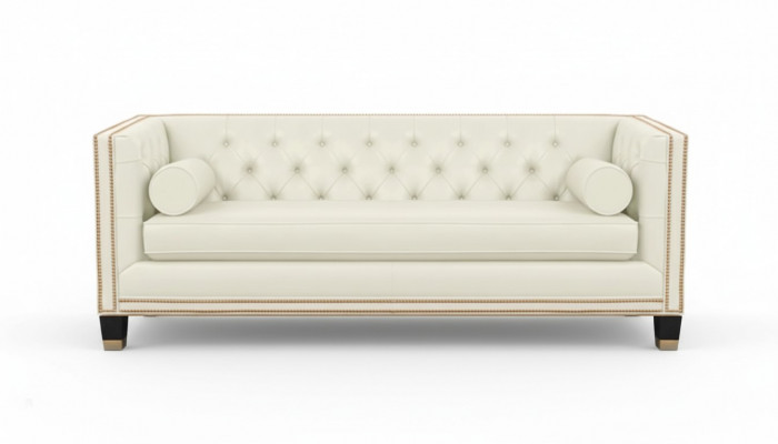 Beżowa sofa Chesterfield z mebli ze skóry do nowoczesnego salonu.