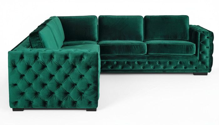 Zielony narożnik Chesterfield w nowoczesnym designie salonu - meble, w których można znaleźć narożnik wykonany ze szlachetnego materiału.