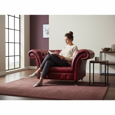 Fotel do salonu Chesterfield w kolorze czerwonym, wykonany z designerskiej skóry, jednomiejscowy.