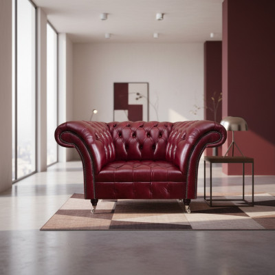 Fotel do salonu Chesterfield w kolorze czerwonym, wykonany z designerskiej skóry, jednomiejscowy.