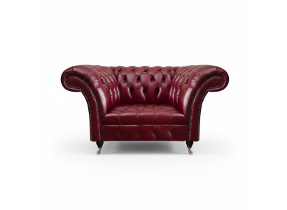 Fotel do salonu Chesterfield w kolorze czerwonym, wykonany z designerskiej skóry, jednomiejscowy.
