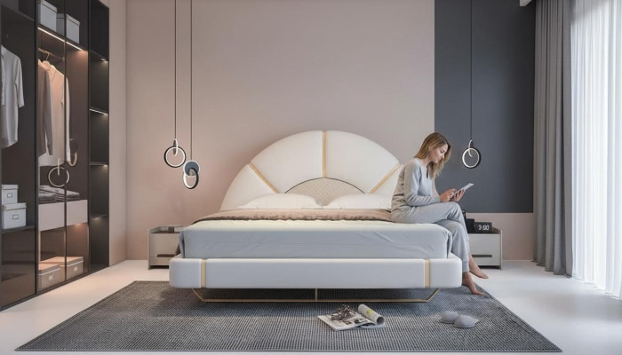 Luksusowe łóżko z złotymi akcentami nowoczesny design półokrągłe wezgłowie sypialnia
